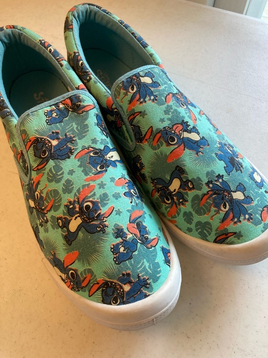 Disney Shoes - Disney Stitch Teal Slip-On Sneakers with Blue and Orange Print